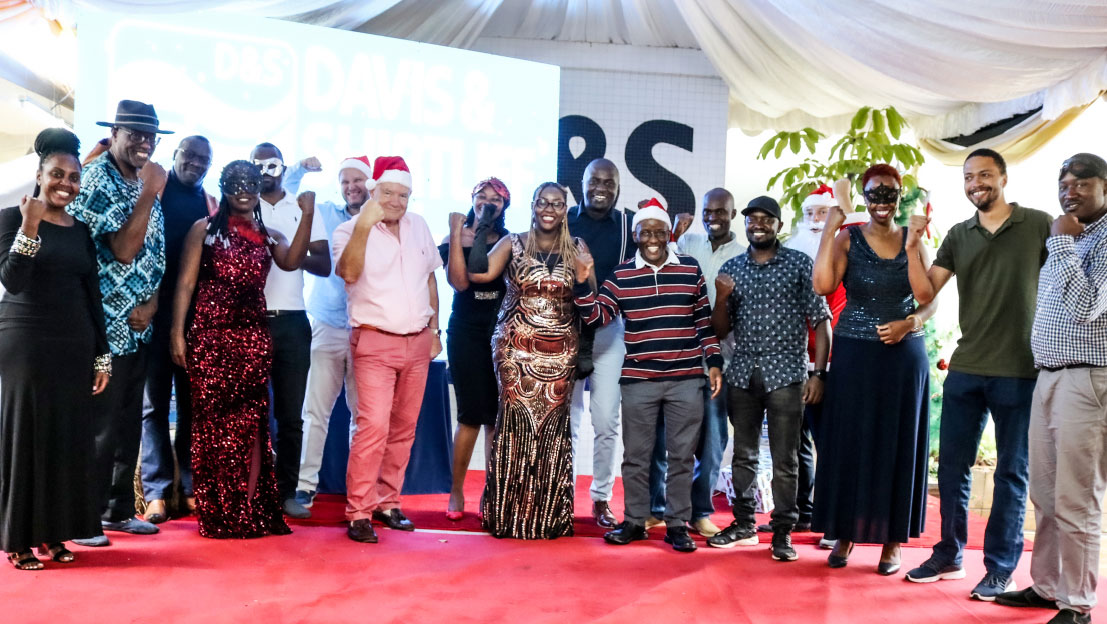 Christmas Party photo featuring Group Chairman Alec Davis, Group CEO George Mbugua and other December Babies